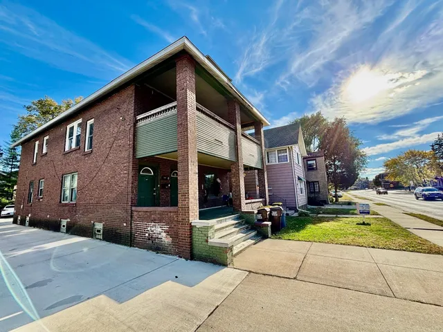 a view of the house with a yard