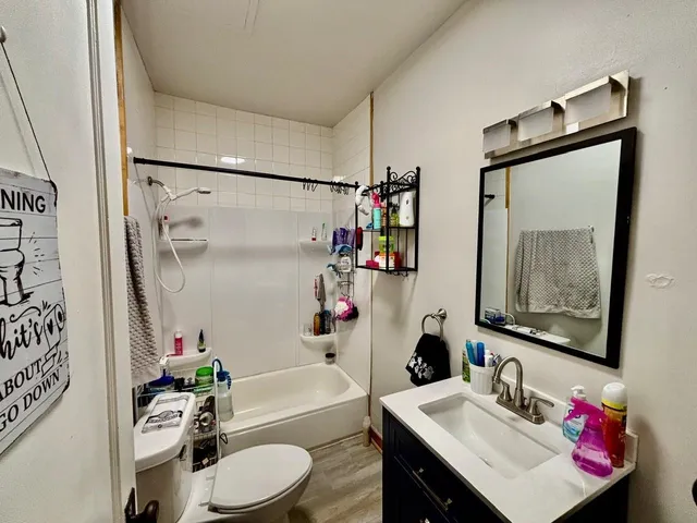 a kitchen with stainless steel appliances a sink and a large window