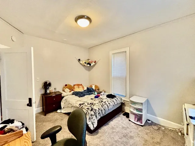 a kitchen with stainless steel appliances a stove a sink and a refrigerator