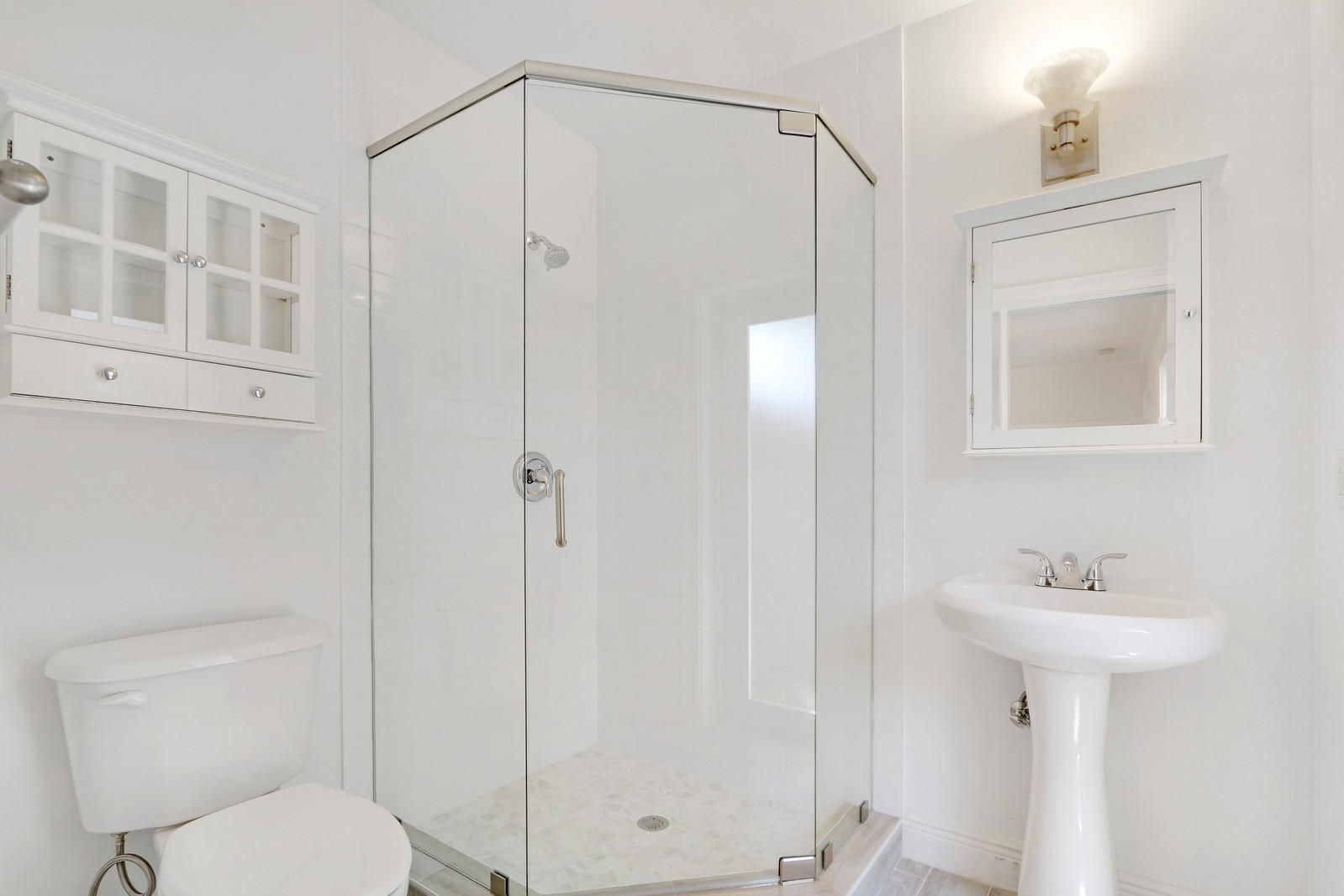 1329 Northwest 6th Street Boca Raton, FL 33486 - Photo 12 of 27 a bathroom with a sink a toilet and shower