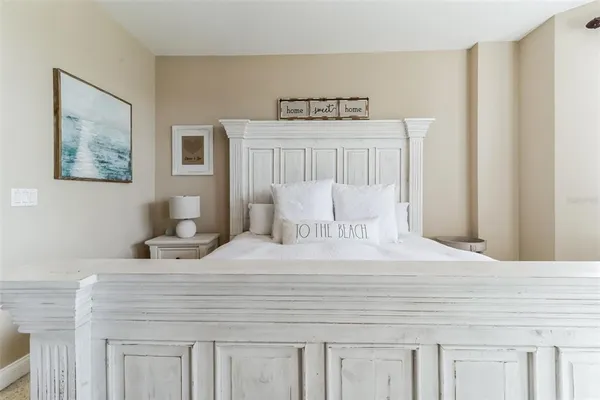 a view of a patio with a table and chairs and potted plants