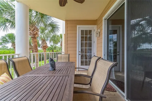a view of a house with a swimming pool and sitting area