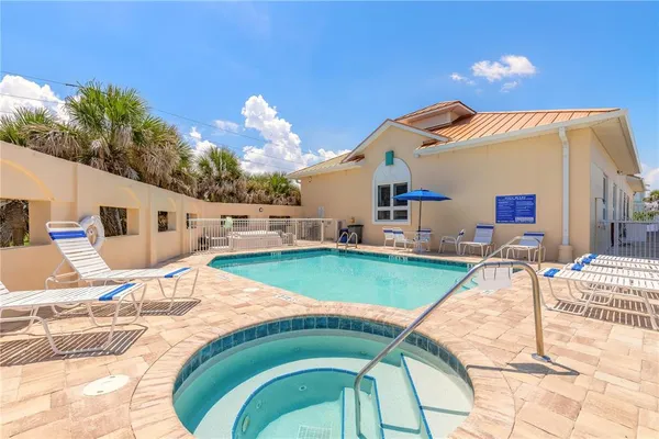 a view of a balcony with wooden floor