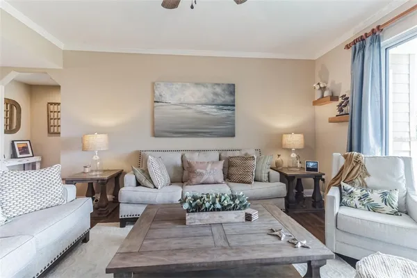 a view of a kitchen with furniture and wooden floor