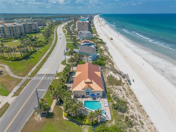 a view of a balcony with furniture