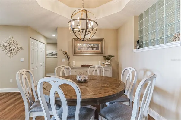 a kitchen with kitchen island a sink appliances and cabinets
