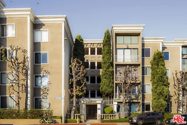 a living room with furniture a flat screen tv and a large window
