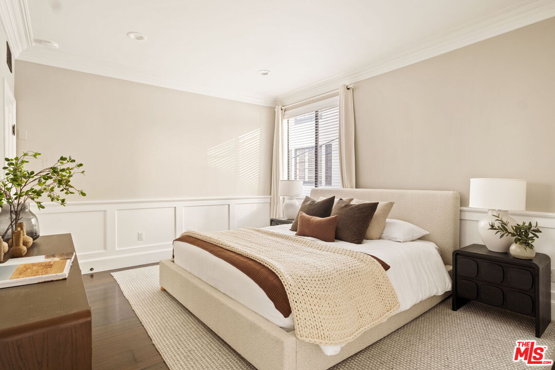 8455 Fountain Avenue, Unit 411 West Hollywood, CA 90069 - Photo 20 of 27 a bedroom with bed and a potted plant