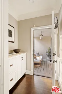 a en suite bathroom with a granite countertop sink and a mirror