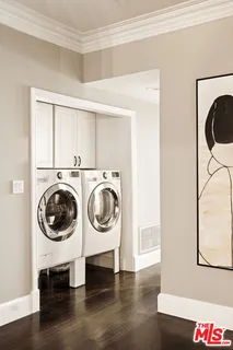 a view of livingroom with washer and dryer