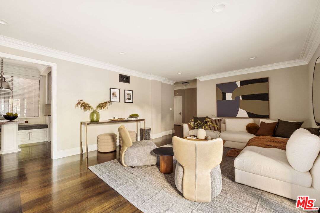 8455 Fountain Avenue, Unit 411 West Hollywood, CA 90069 - Photo 8 of 27 a living room with furniture and a fireplace