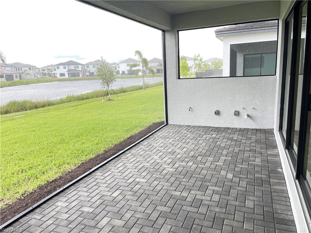 20909 Thistle Leaf Lane Estero, FL 33928 - Photo 16 of 18 a view of an outdoor space with a lake view