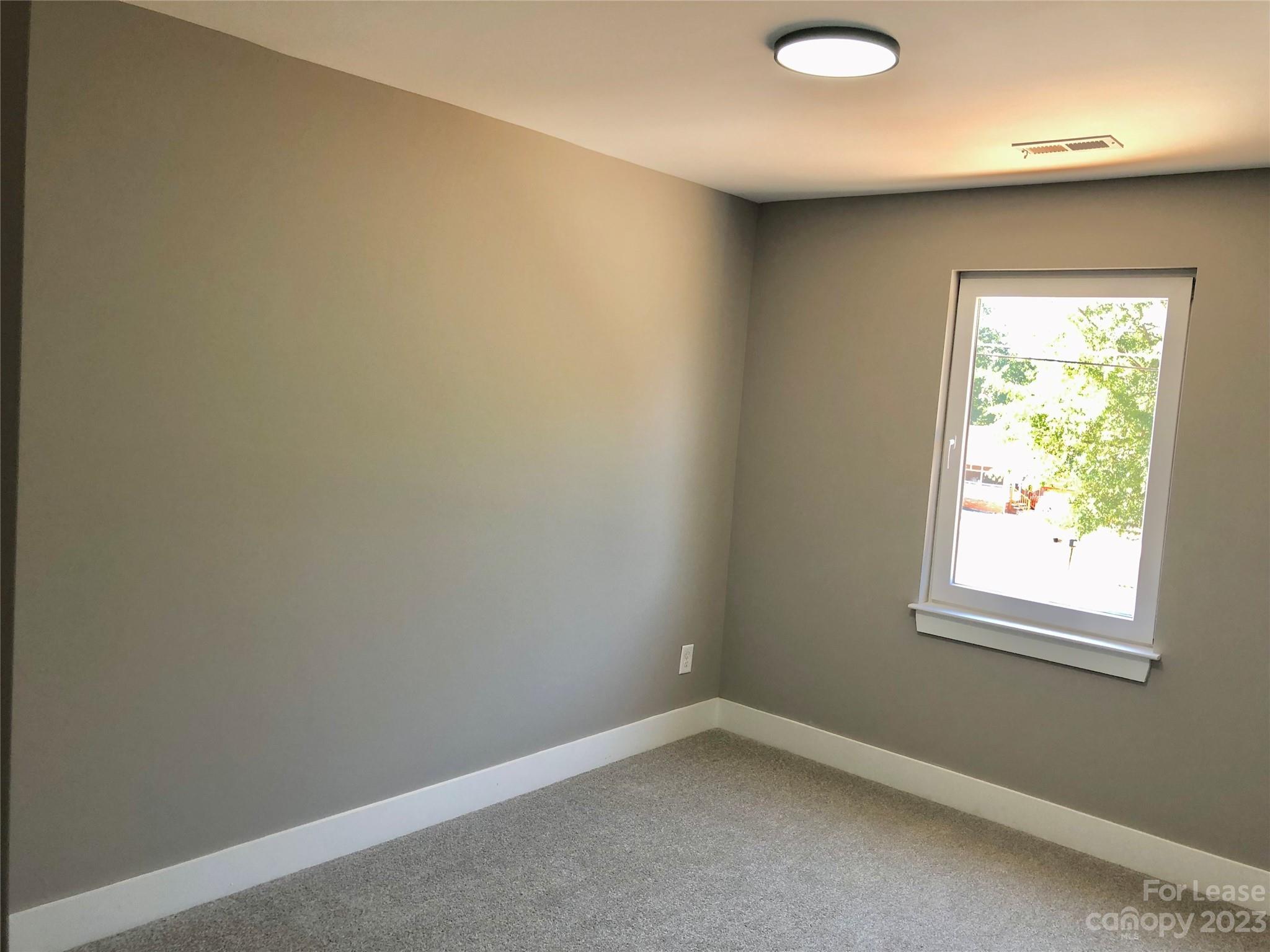 2435 Laboratory Road Lincolnton, NC 28092 - Photo 16 of 19 an empty room with a window
