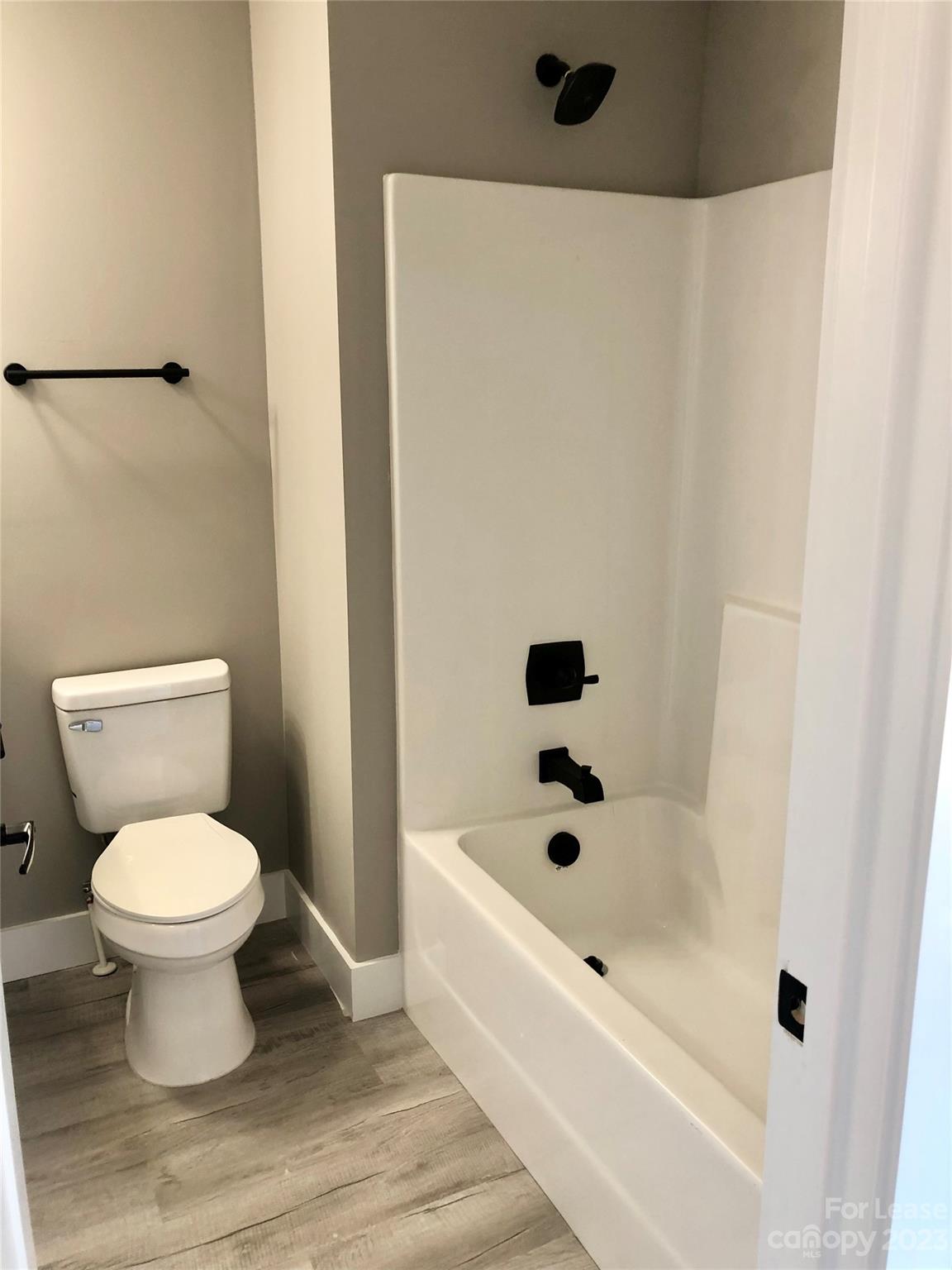 2435 Laboratory Road Lincolnton, NC 28092 - Photo 17 of 19 a bathroom with a toilet and a bathtub