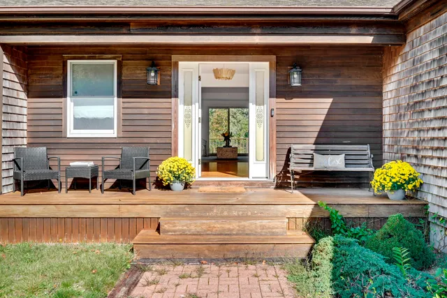 a view of house with outdoor space and seating space