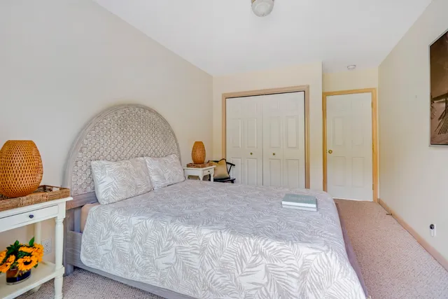 a bedroom with bed and a window