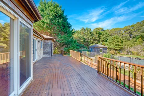 a view of a balcony with wooden floor
