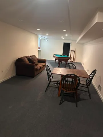 a living room with furniture and a table