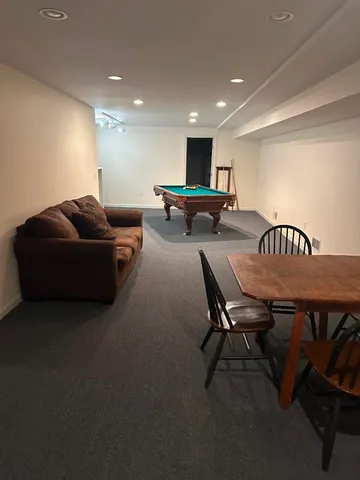 a living room with furniture and a table