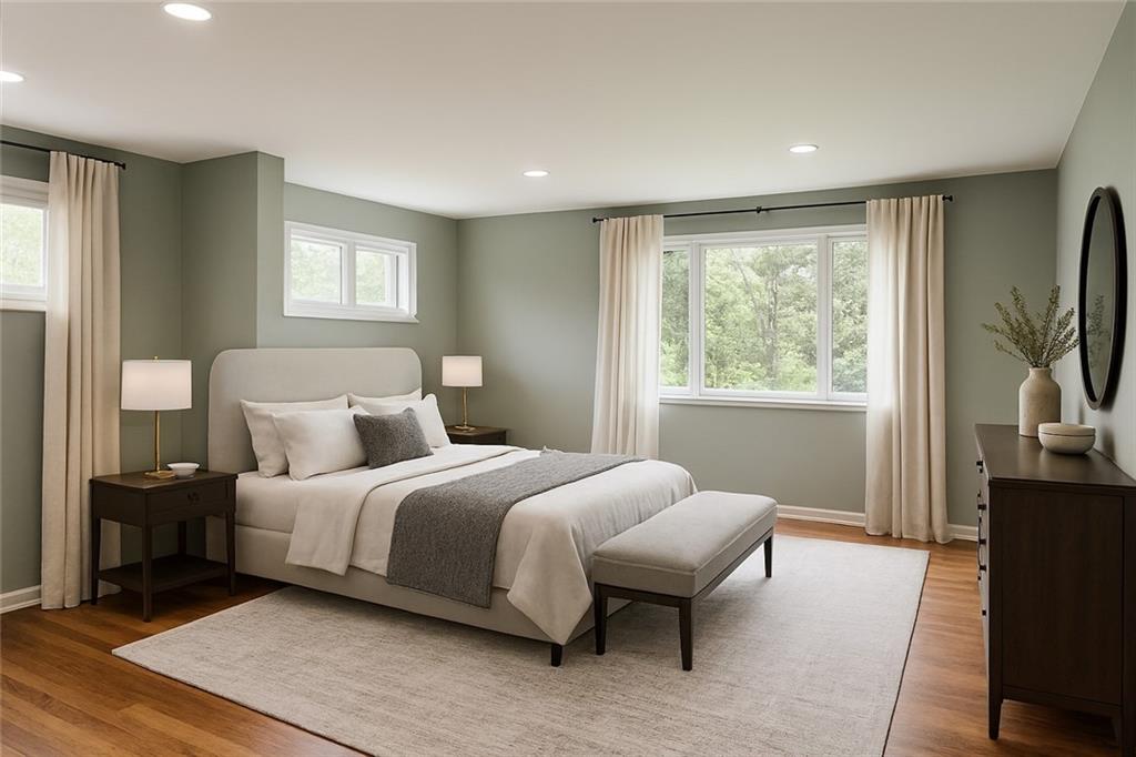 1535 Powers Run Road Pittsburgh, PA 15238 - Photo 11 of 22 a bedroom with a bed and a flat tv screen on a dresser