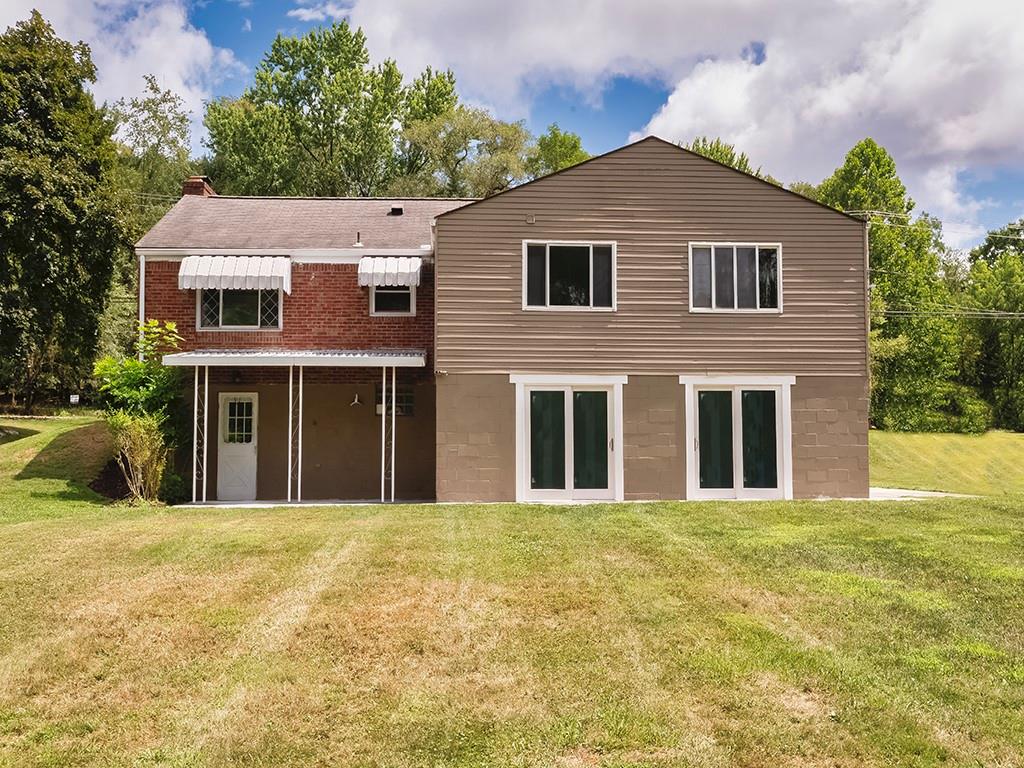 1535 Powers Run Road Pittsburgh, PA 15238 - Photo 19 of 22 a front view of a house with a yard