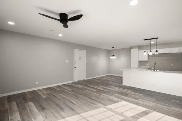 a view of a kitchen with a sink cabinetry and a ceiling fan