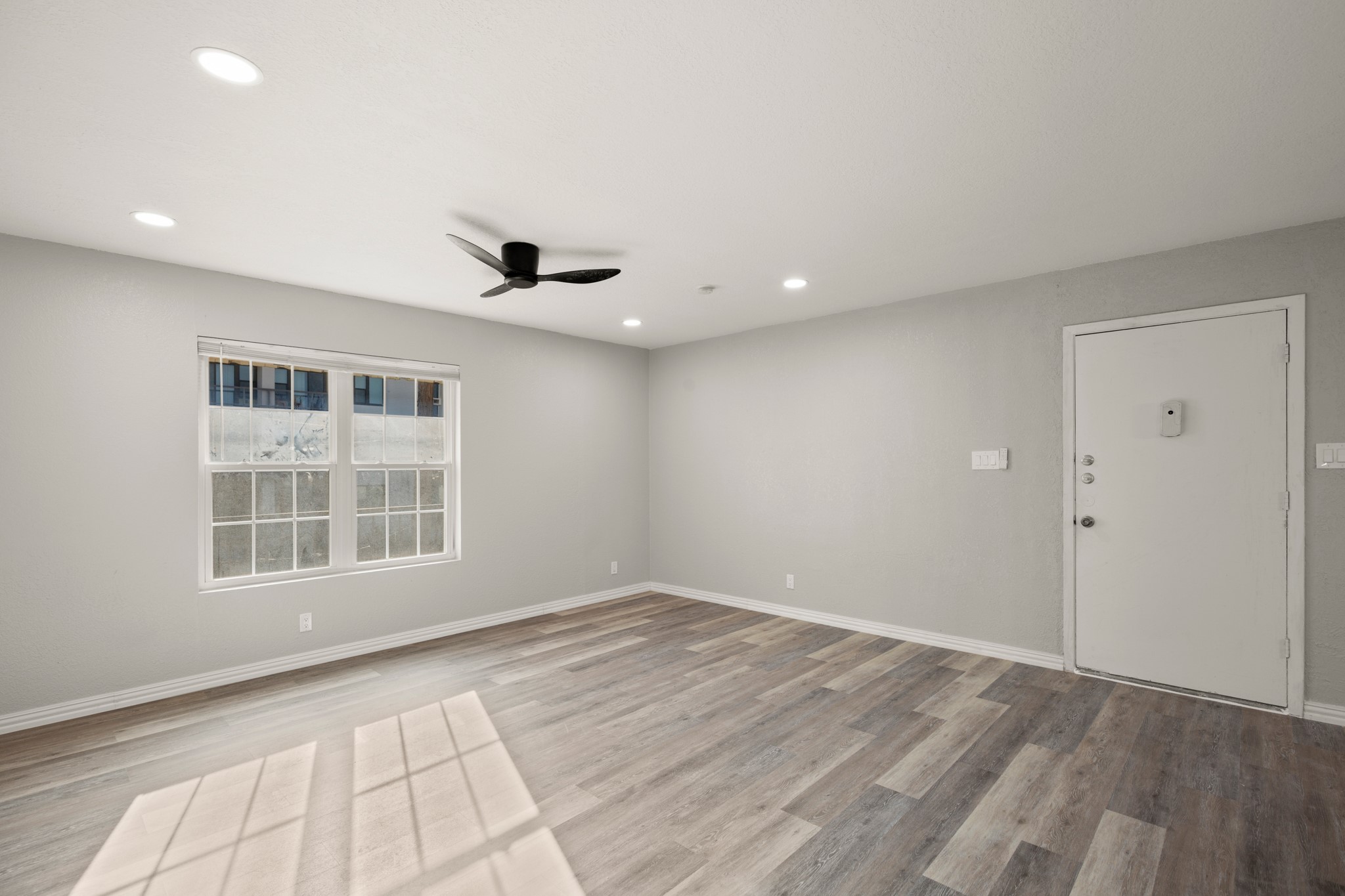 910 Duncan Lane, Unit 56 Austin, TX 78705 - Photo 4 of 17 a view of empty room with windows