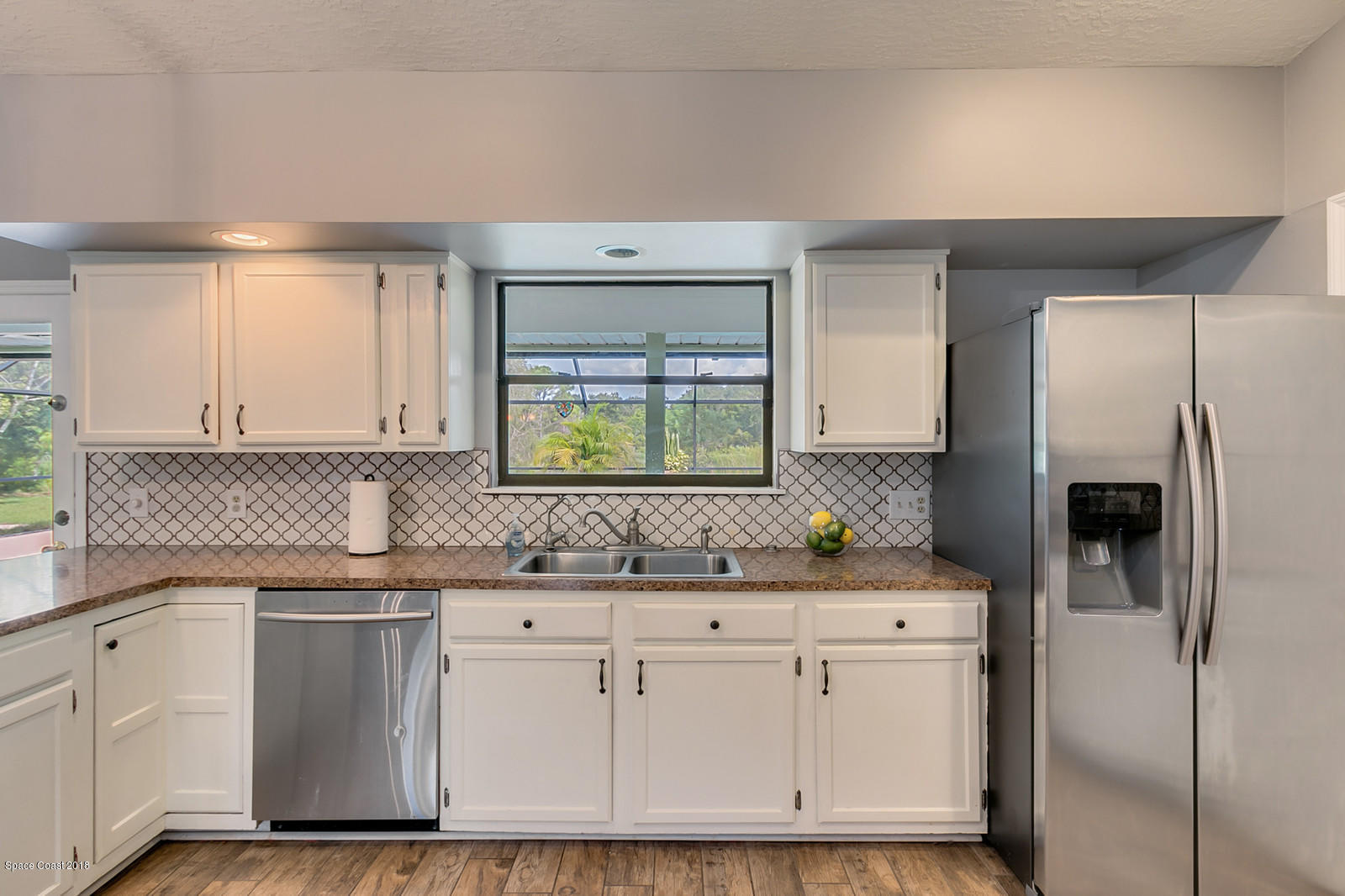 4300 Country Road Melbourne, FL 32934 - Photo 12 of 46 Kitchen Window Overlooking Pool