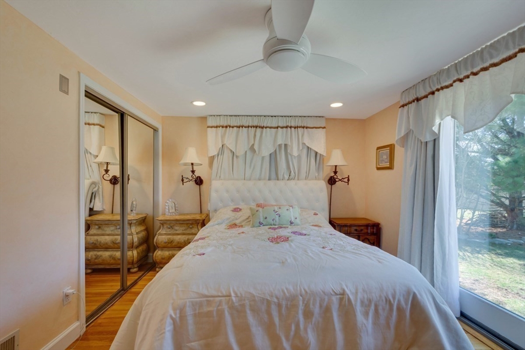 4 Worcester Road Sharon, MA 02067 - Photo 14 of 25 a bedroom with a bed and a mirror