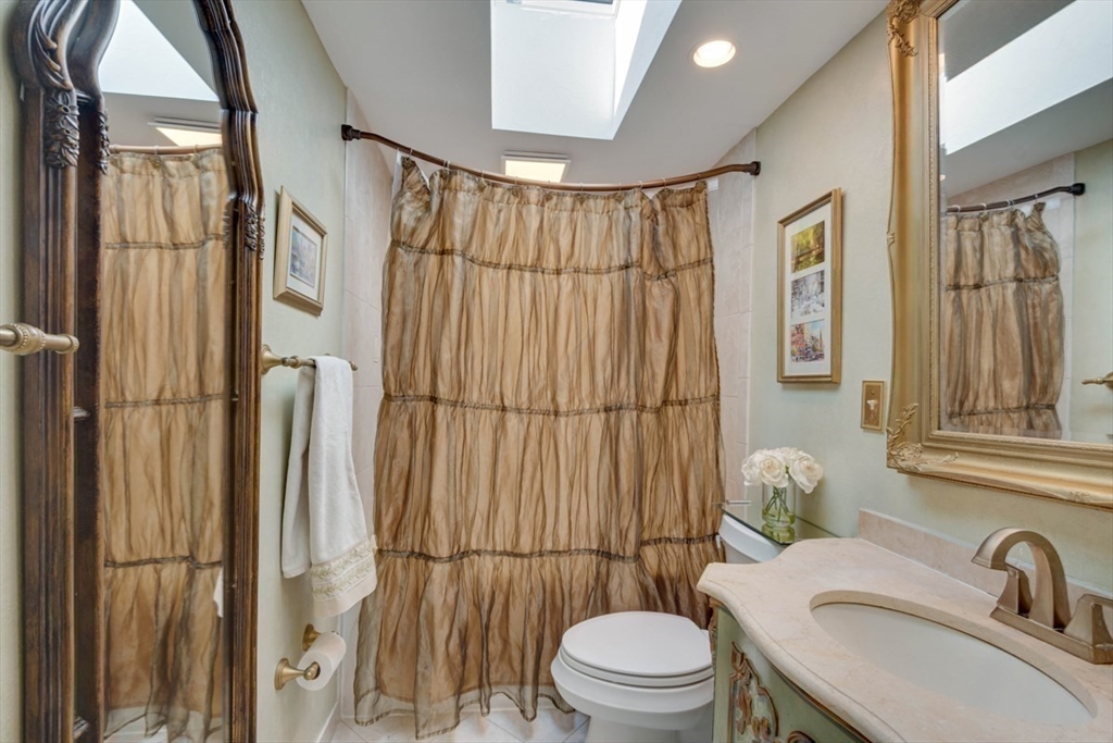 4 Worcester Road Sharon, MA 02067 - Photo 17 of 25 a white toilet sitting next to a bathroom sink