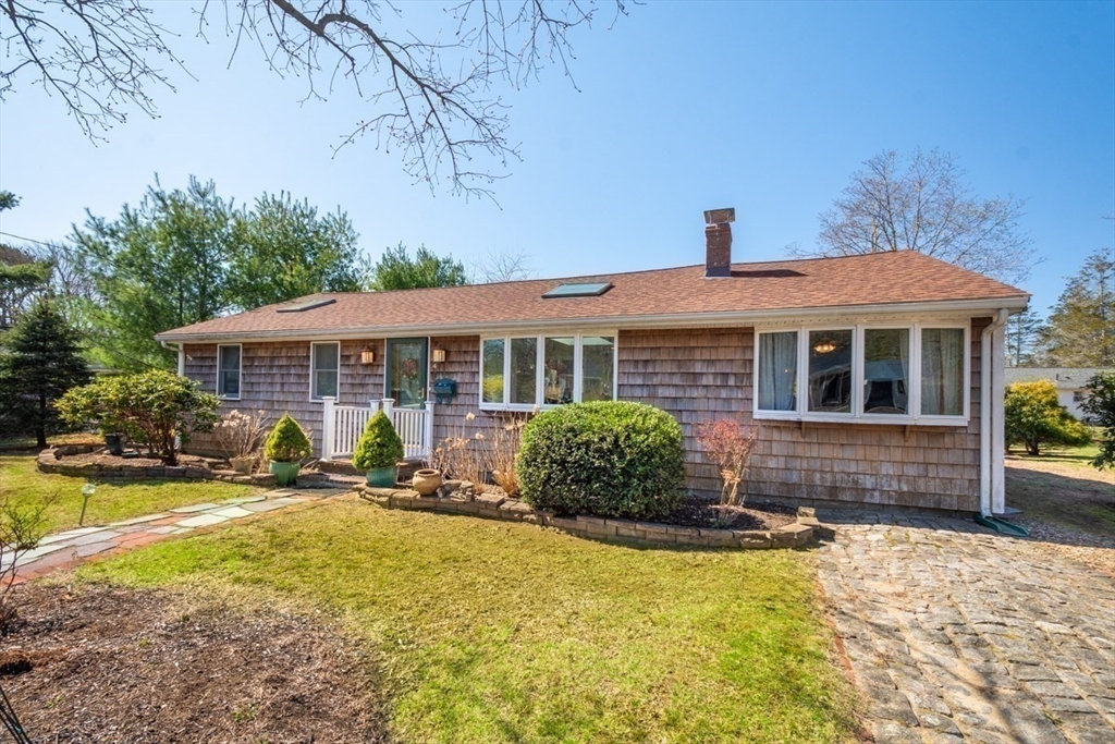 4 Worcester Road Sharon, MA 02067 - Photo 23 of 25 a front view of a house with a yard patio and fire pit