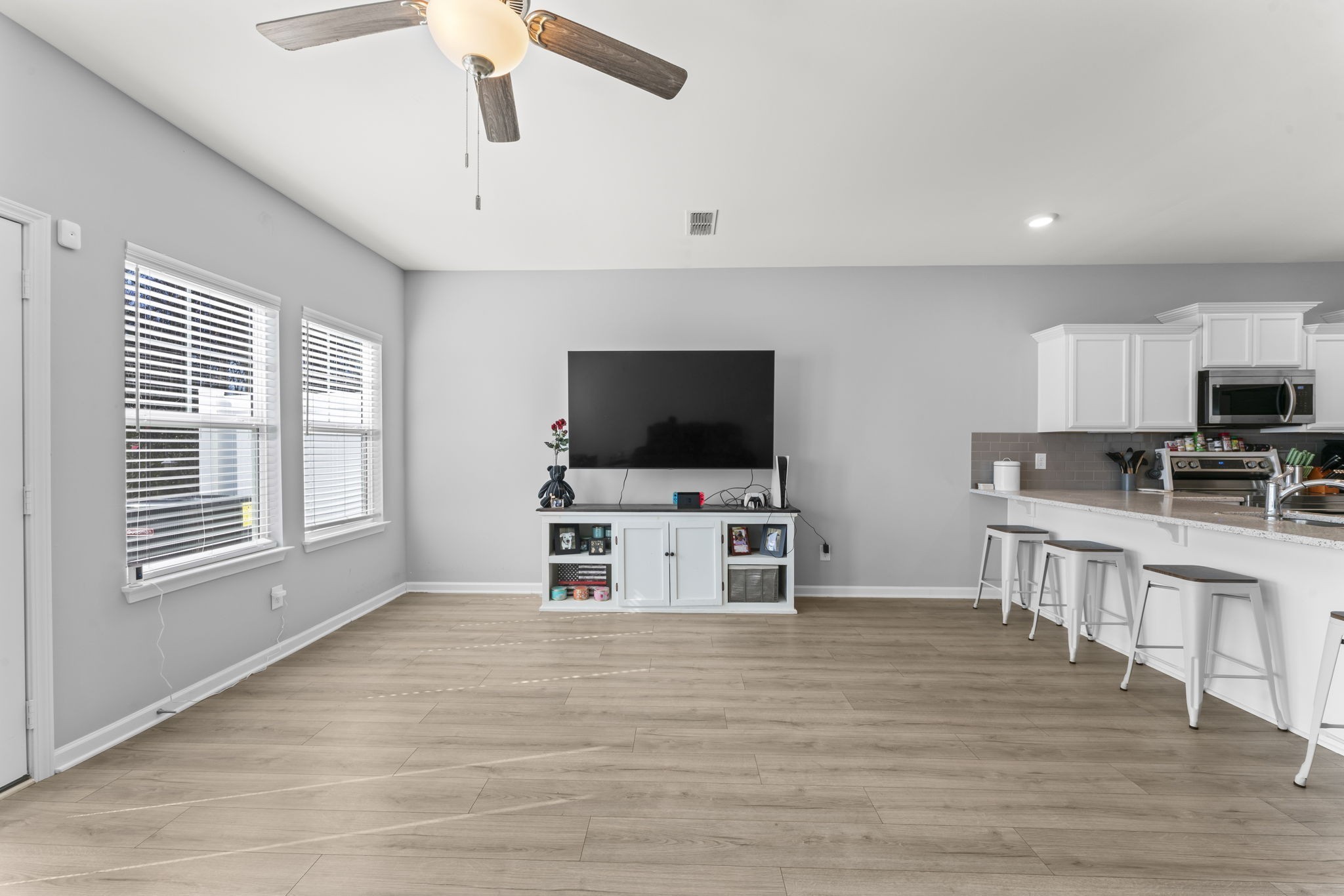 5711 Dockside Drive Rockvale, TN 37153 - Photo 15 of 30 a living room with furniture wooden floor and a flat screen tv