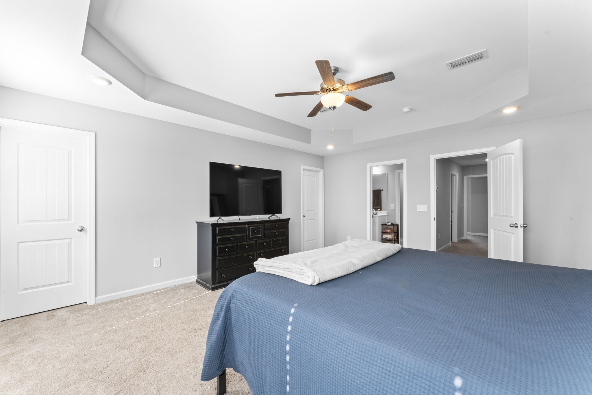 5711 Dockside Drive Rockvale, TN 37153 - Photo 19 of 30 a bedroom with a large bed and a flat screen tv