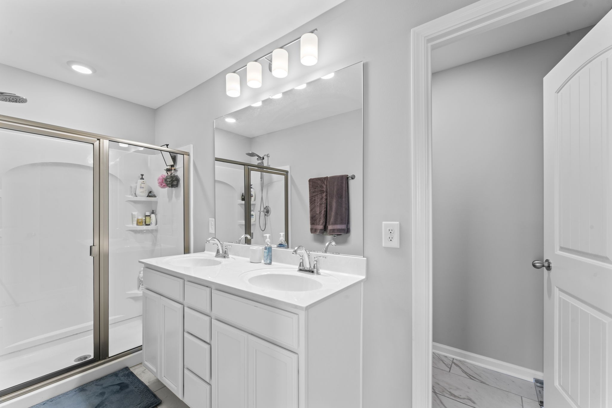 5711 Dockside Drive Rockvale, TN 37153 - Photo 20 of 30 a bathroom with a sink mirror and shower