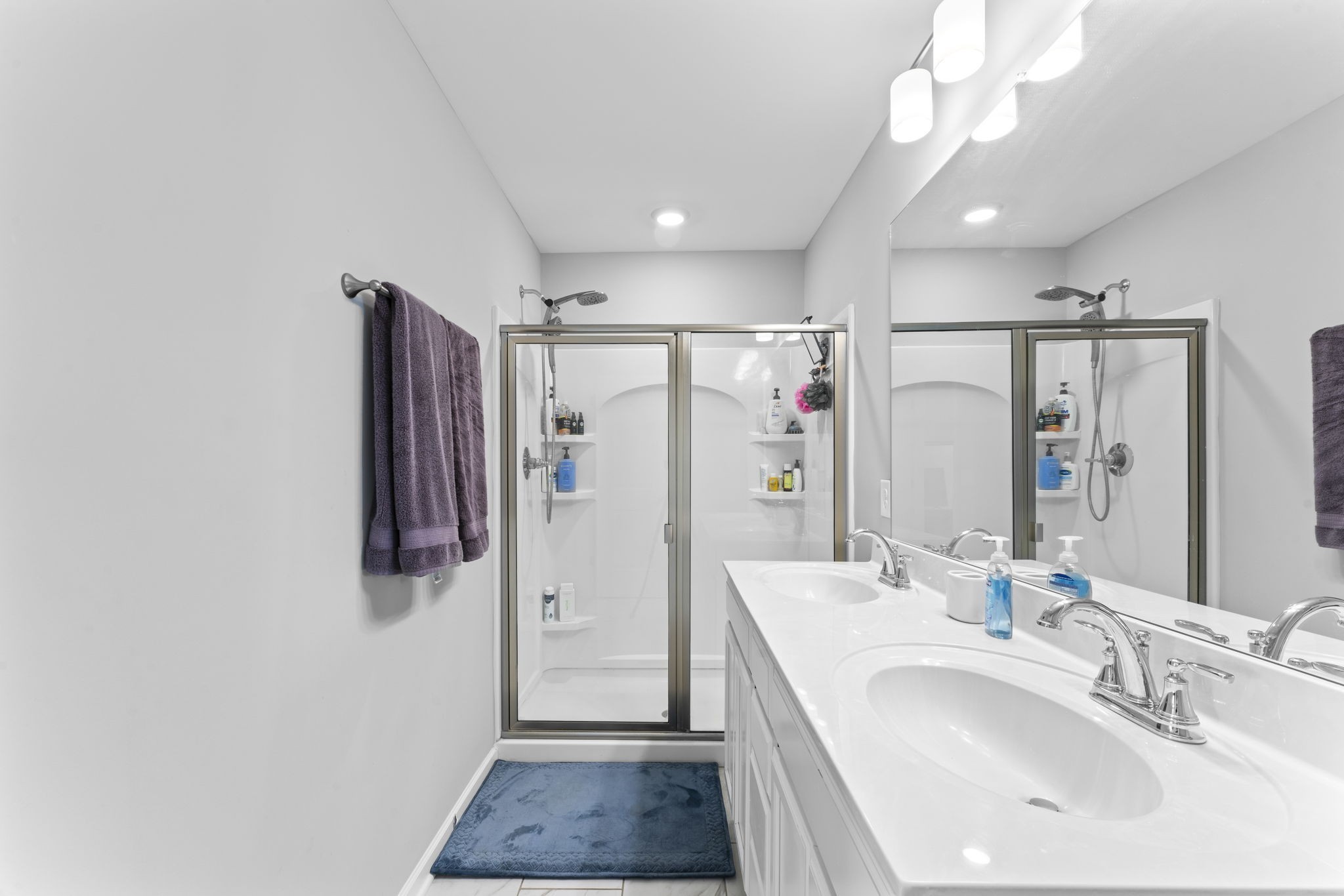 5711 Dockside Drive Rockvale, TN 37153 - Photo 21 of 30 a bathroom with a sink a mirror and shower