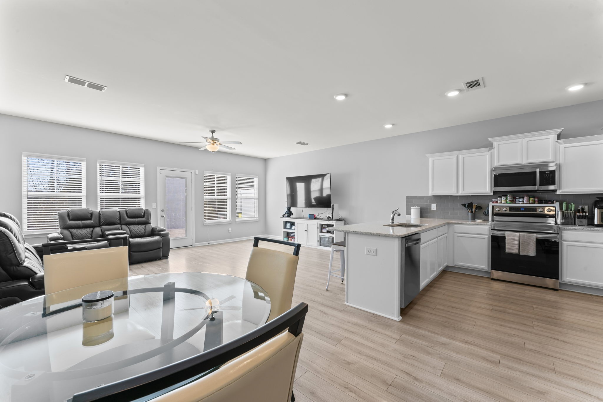5711 Dockside Drive Rockvale, TN 37153 - Photo 7 of 30 a kitchen with sink refrigerator and stove top oven