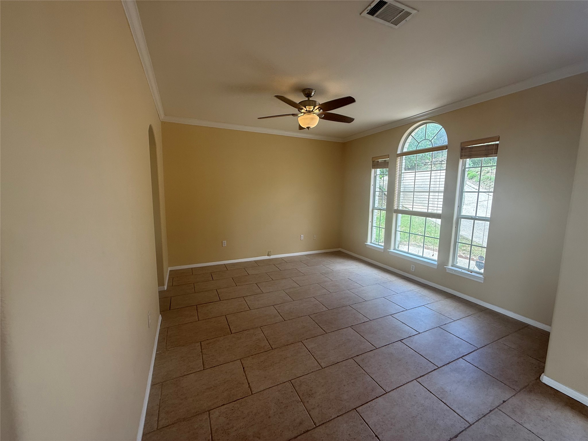 13612 Bullick Hollow Road Austin, TX 78726 - Photo 4 of 34 an empty room with windows and fan