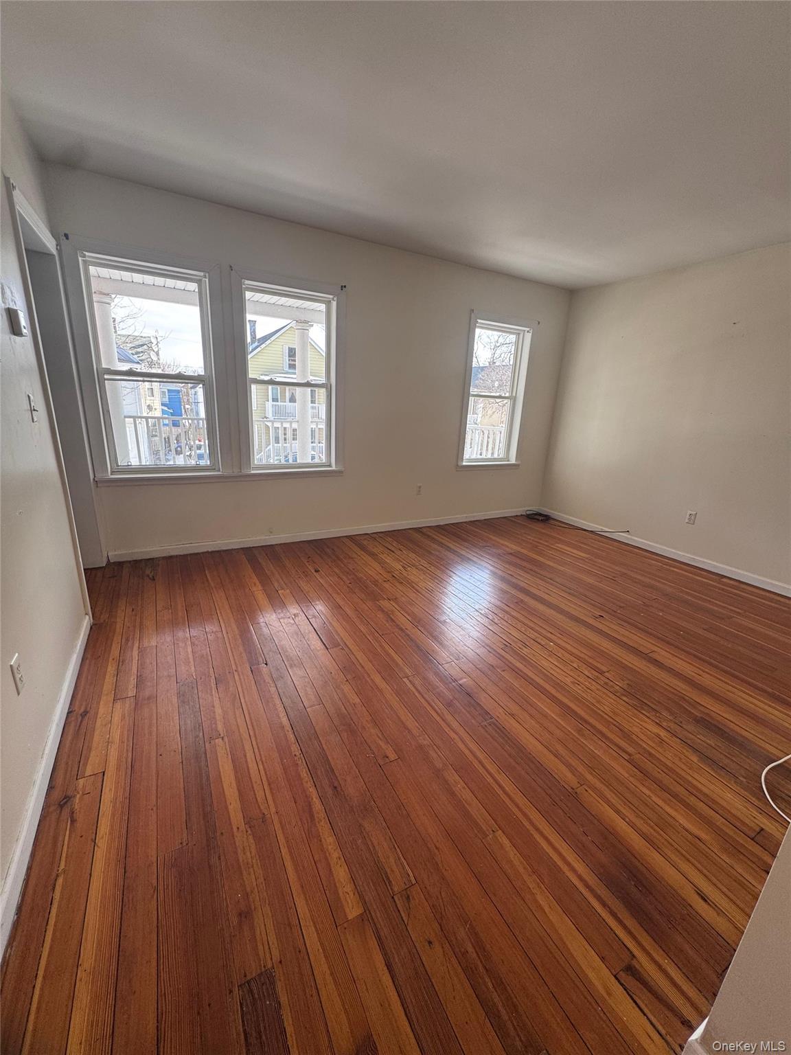 4 Gray Street, Unit #2 Poughkeepsie, NY 12603 - Photo 11 of 27 an empty room with wooden floor and windows