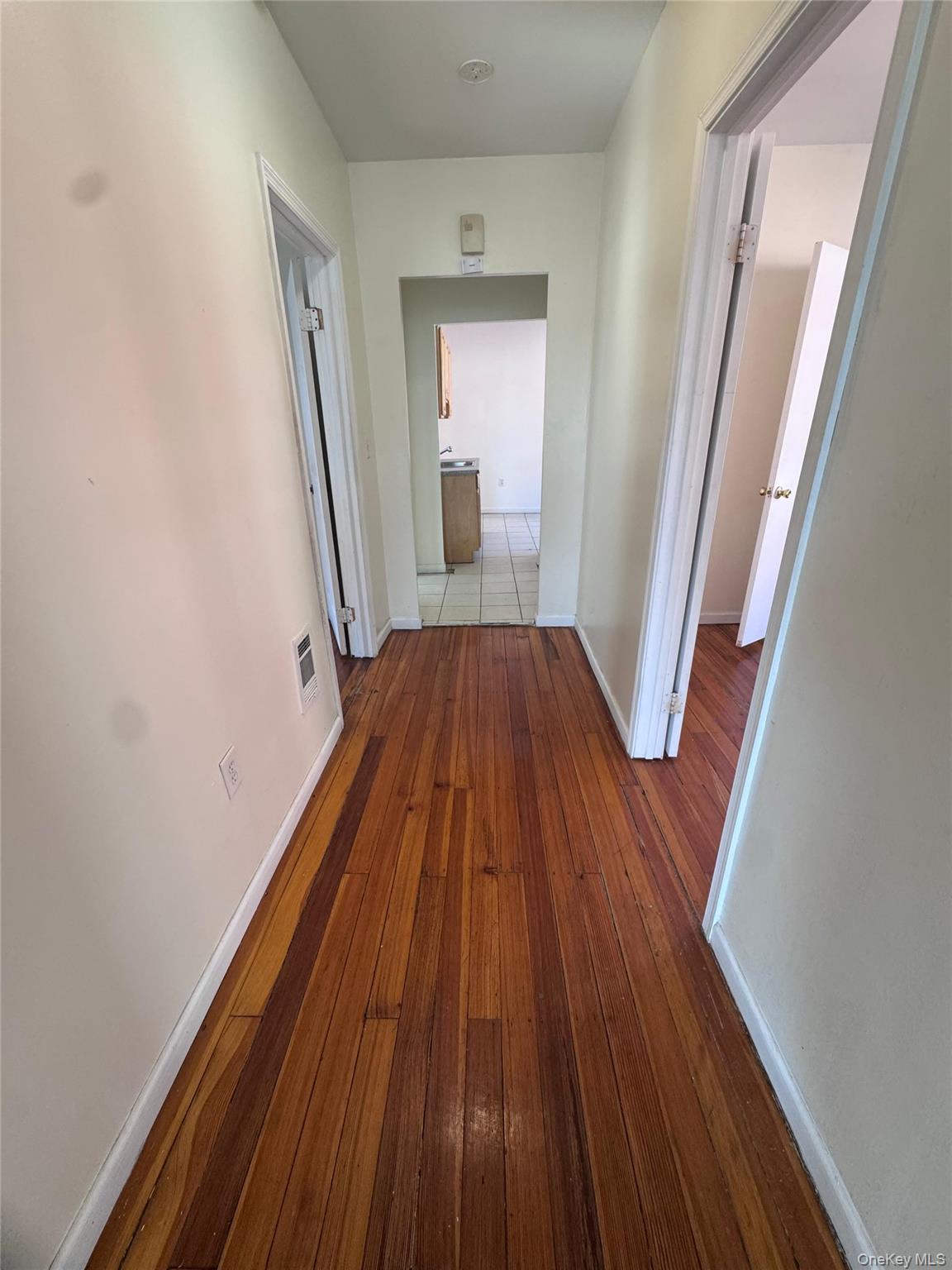 4 Gray Street, Unit #2 Poughkeepsie, NY 12603 - Photo 12 of 27 a view of a hallway with wooden floor and staircase