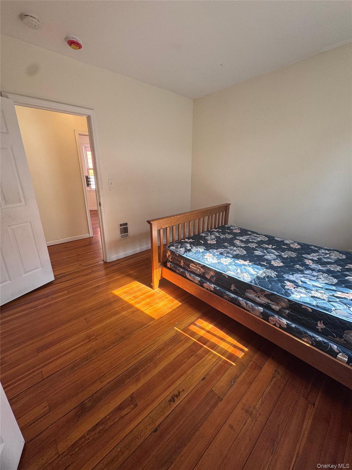 4 Gray Street, Unit #2 Poughkeepsie, NY 12603 - Photo 17 of 27 a bedroom with wooden floor and bedroom