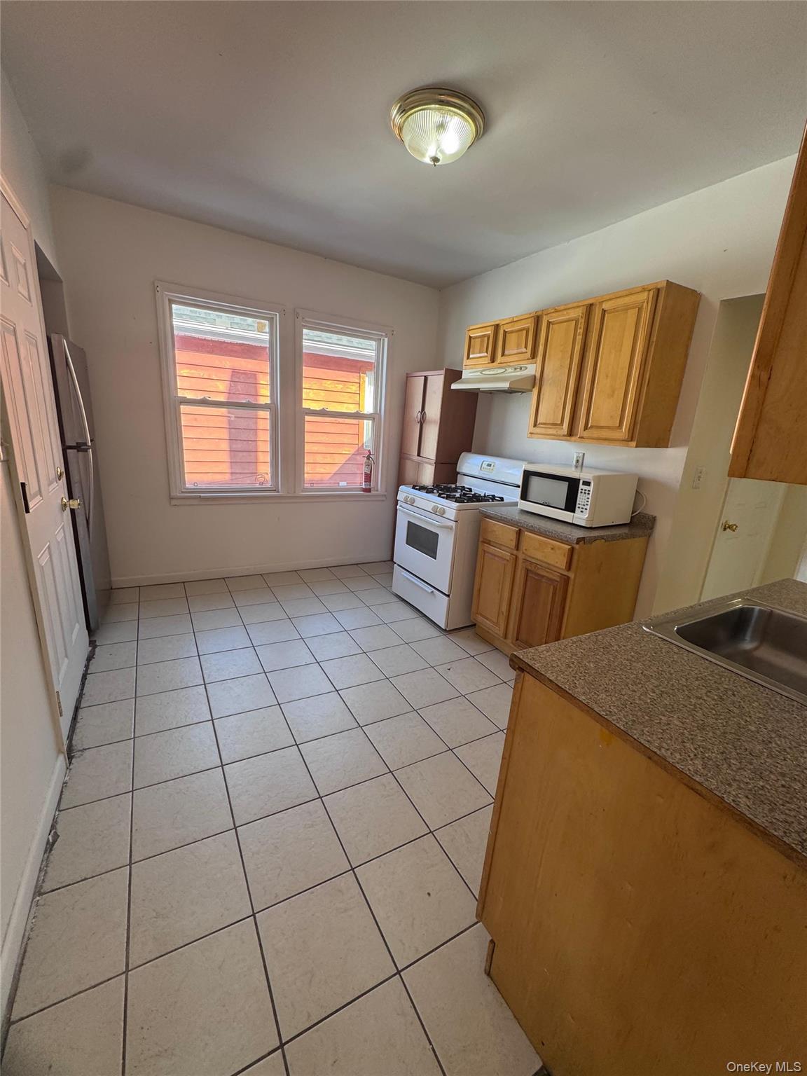4 Gray Street, Unit #2 Poughkeepsie, NY 12603 - Photo 23 of 27 a view of kitchen and window