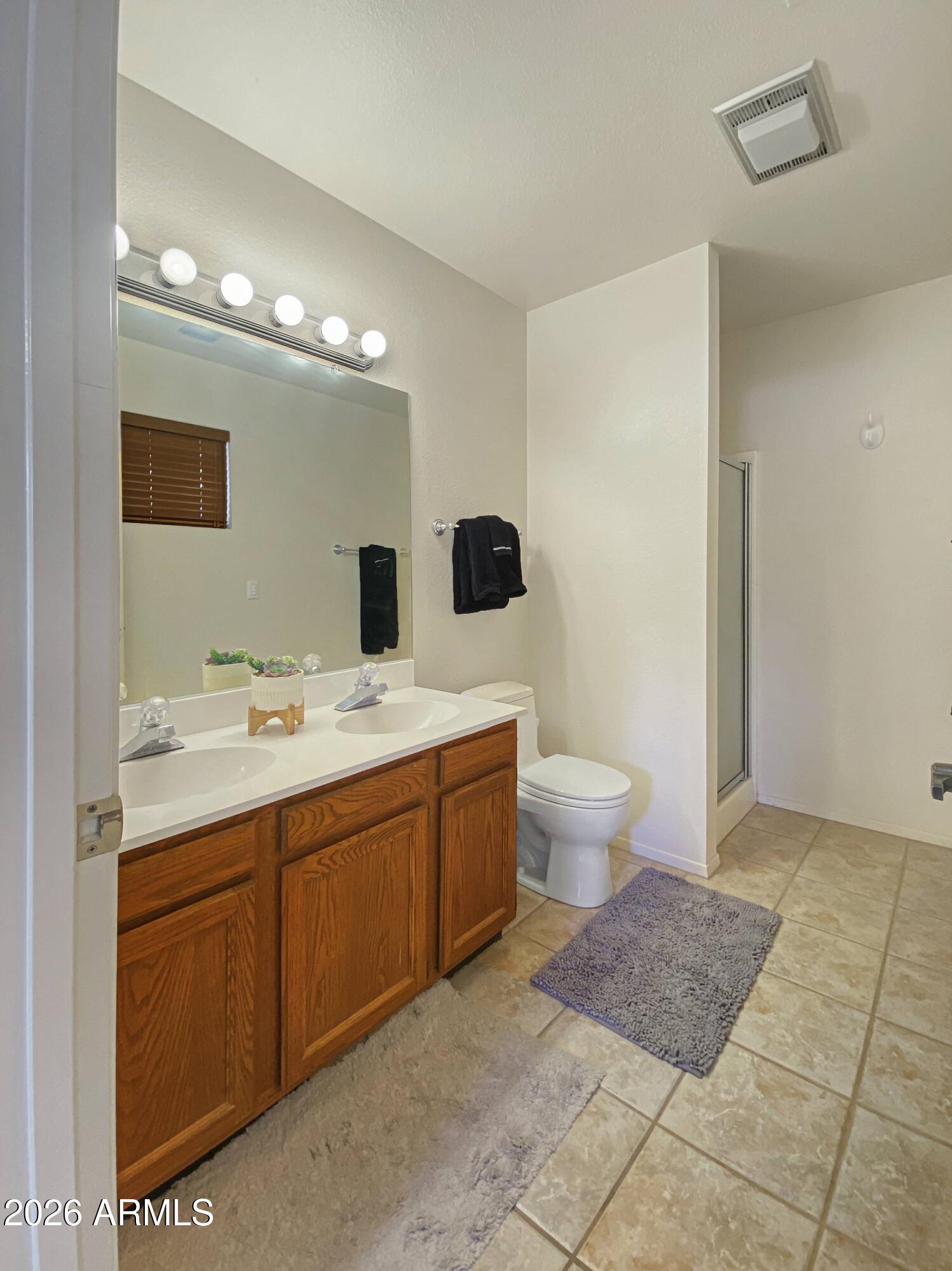 550 Barcelona Road Sedona, AZ 86336 - Photo 19 of 32 a bathroom with a double vanity sink mirror and toilet