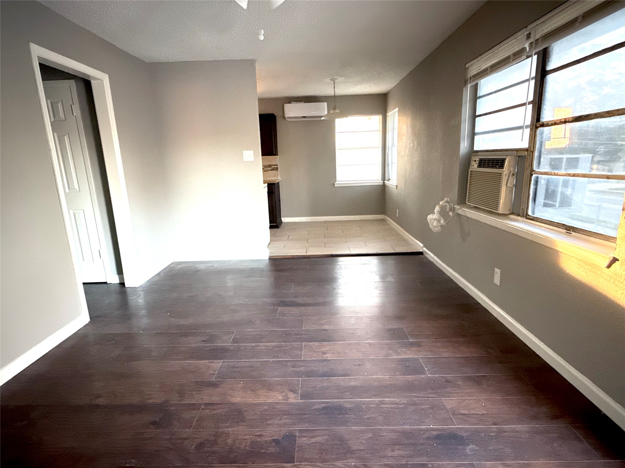 5418 Weaver Road, Unit D Houston, TX 77016 - Photo 2 of 12 wooden floor in an empty room with a window