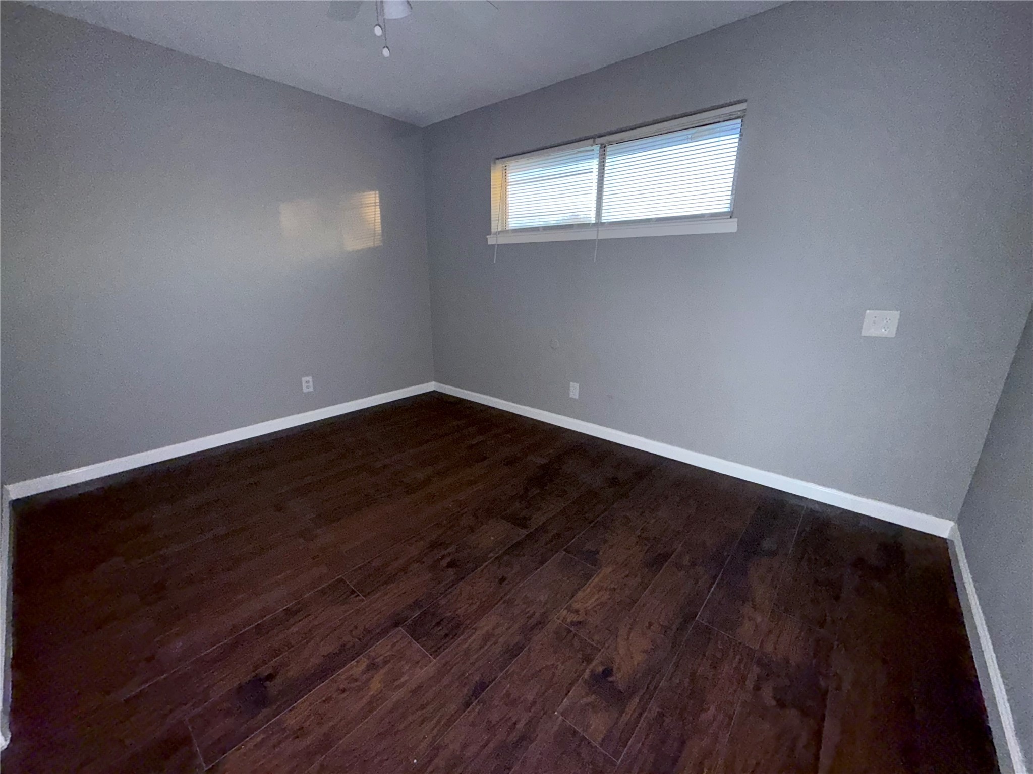 5418 Weaver Road, Unit D Houston, TX 77016 - Photo 9 of 12 a view of a room with wooden floor and window