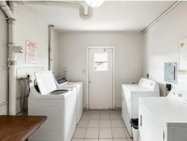 an aerial view of a house with a lake view