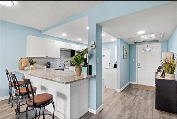 a kitchen with a sink stove and microwave