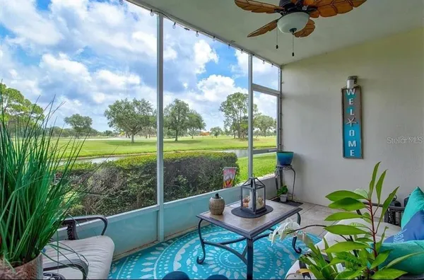 a bedroom with a bed and a television