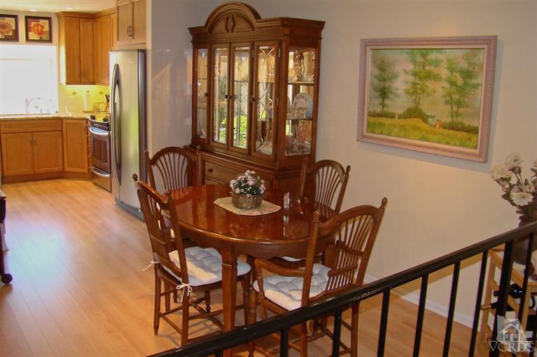 19515 Rinaldi Street, Unit 54 Northridge, CA 91326 - Photo 4 of 20 a view of a dining room with furniture and window