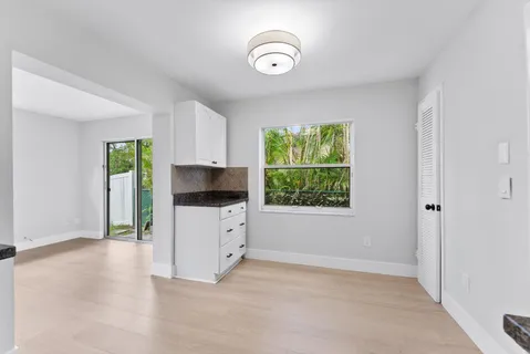 a view of a kitchen with furniture and a window