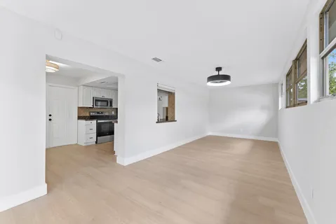 a view of kitchen with refrigerator